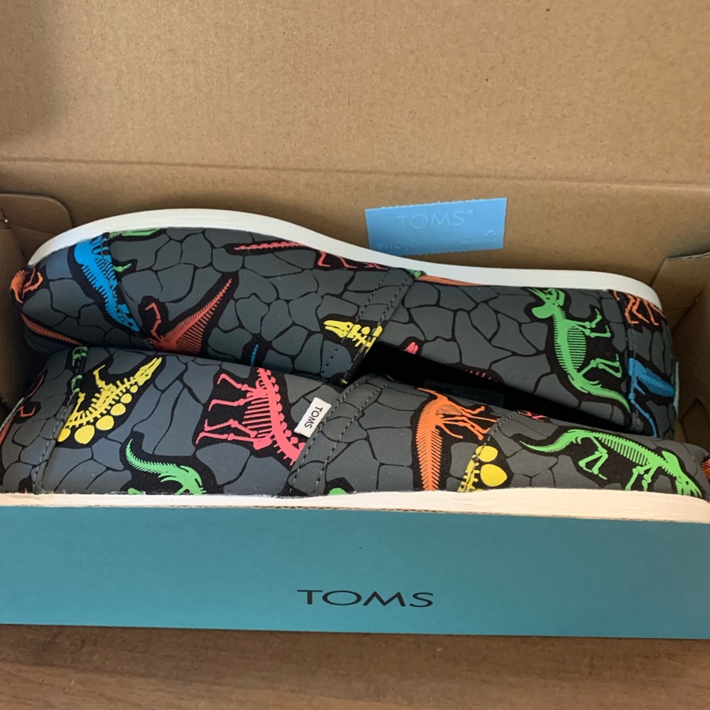 Toms Womens size 7.  New with tags and box.  Black Dinosaur print.